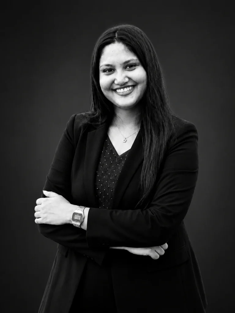 Professional Digital Marketing Services in Kasaragod expert smiling in a professional black blazer portrait for business branding and online marketing.